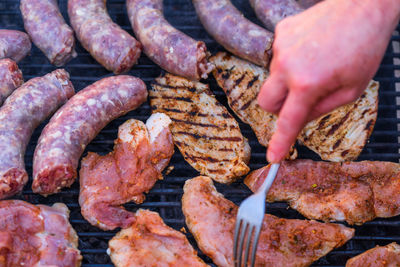 Cropped hand of person preparing food