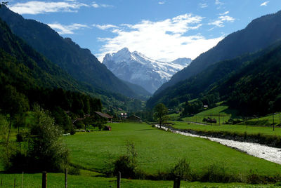 Scenic view of landscape and mountains against sky