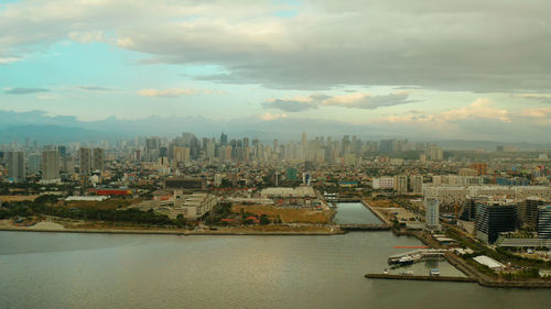 The city of manila, the capital of the philippines. modern metropolis at sunset, top view. 