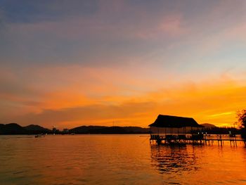 Scenic view of sea against orange sky