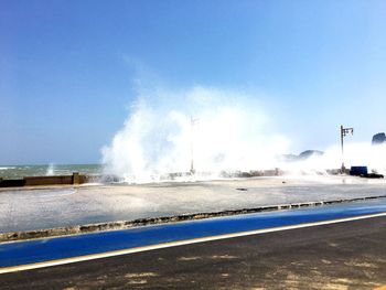 Panoramic view of sea against clear blue sky