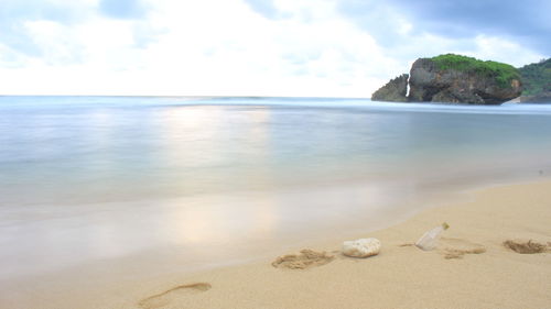 Scenic view of beach against sky