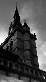 Low angle view of clock tower against sky