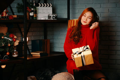 Portrait of smiling young woman at home