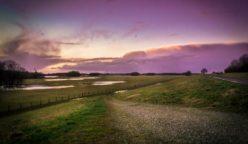 Scenic view of landscape against sky during sunset