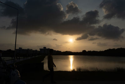 Scenic view of lake against sky during sunset