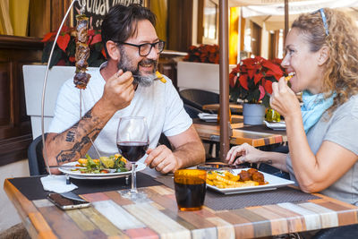 Friends having food at restaurant