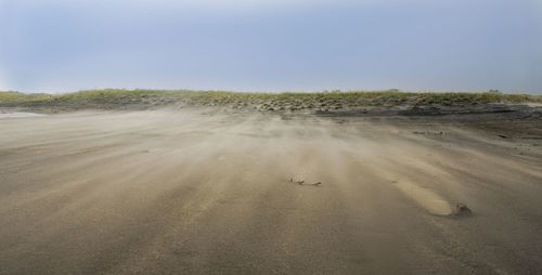 Scenic view of desert against clear sky