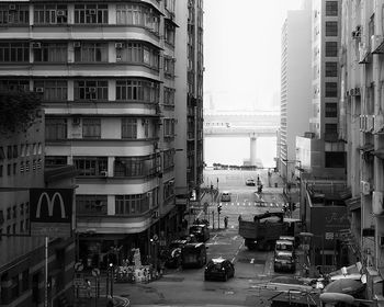 View of city street and buildings against sky