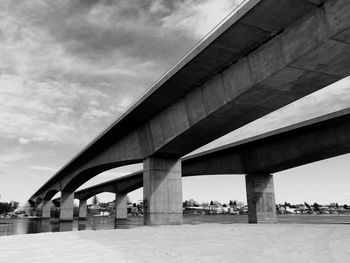 Low angle view of elevated road against sky