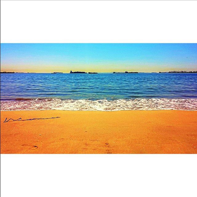 sea, water, horizon over water, beach, transfer print, shore, auto post production filter, blue, nature, tranquility, wave, scenics, beauty in nature, tranquil scene, outdoors, copy space, sand, yellow, no people, day