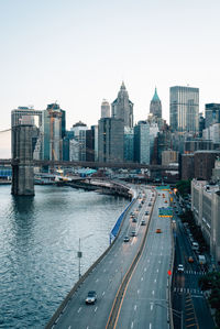 High angle view of traffic on road by buildings against sky