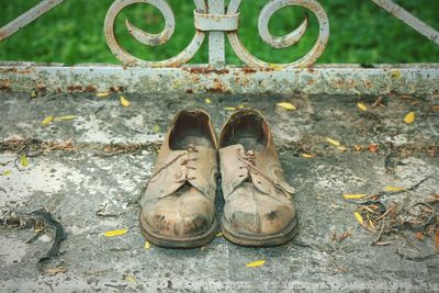 High angle view of shoes on footpath