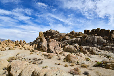 Low angle view of rocks against sky