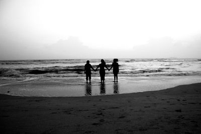 Silhouette of people on beach