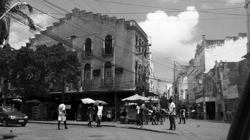 People in city against sky