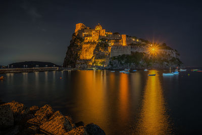 Night view of aragonese castle, the most famous landmark of ischia, campania region, italy