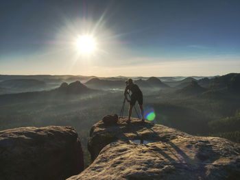 Scenic view of rocks and mountains against sky