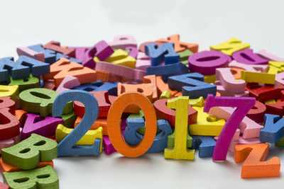 Close-up of multi colored toys against white background