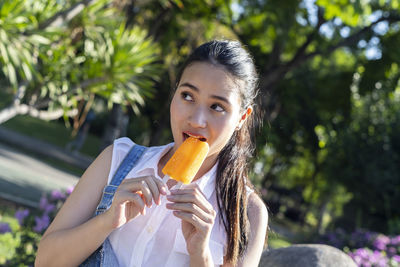 Portrait of woman holding ice cream