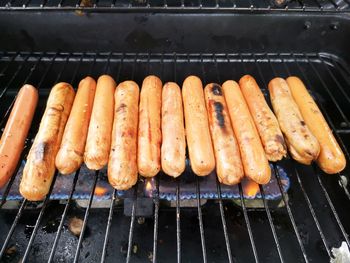 High angle view of meat on barbecue grill