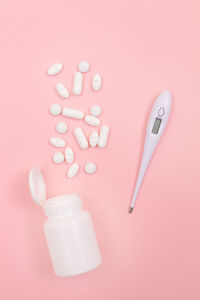 High angle view of pink bottle on table