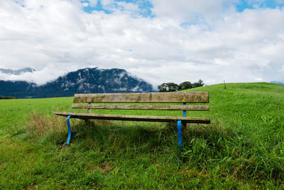 A calm place to rest and relax. an empty wooden bench. switzerland