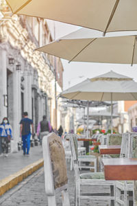 Empty chairs and tables in restaurant