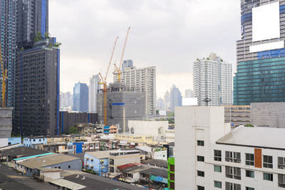 Modern buildings in city against sky