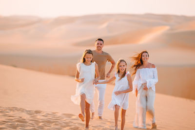 Full length of young woman on beach