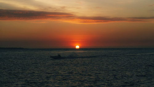 Scenic view of sea at sunset