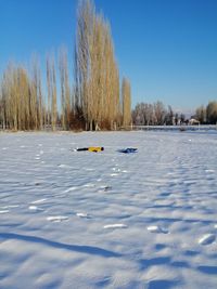 Scenic view of frozen lake against sky during winter