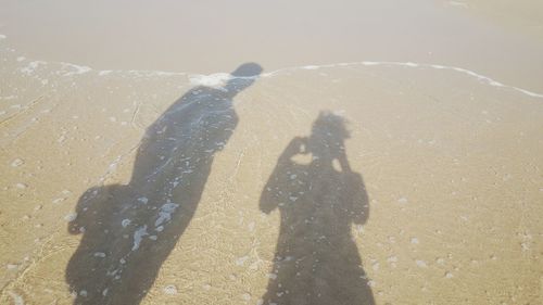 Shadow of people on wall