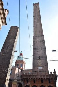 Low angle view of man working against sky