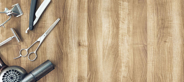 High angle view of work tools on wooden table