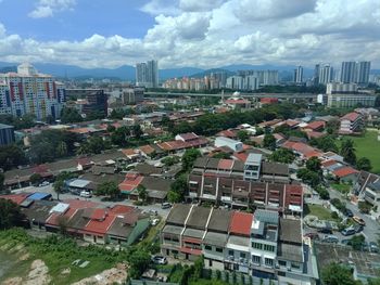 High angle view of buildings in city against sky