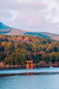 Scenic view of lake against sky during autumn