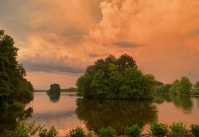 Scenic view of lake against sky during sunset