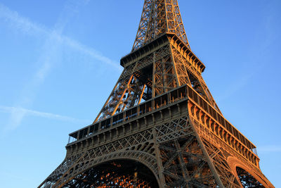 Sunrise hits the eiffel tower in paris, france.