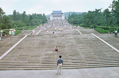 Tourists standing on steps