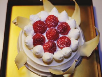 High angle view of strawberries in plate on table