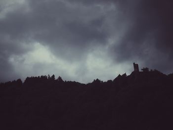 Silhouette landscape against sky