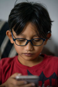 Close-up of boy using smartphone