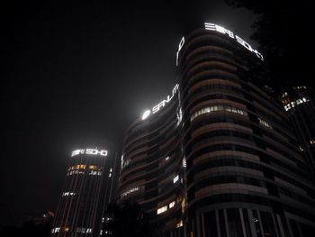 Low angle view of modern building at night