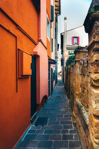 Narrow alley amidst buildings in city