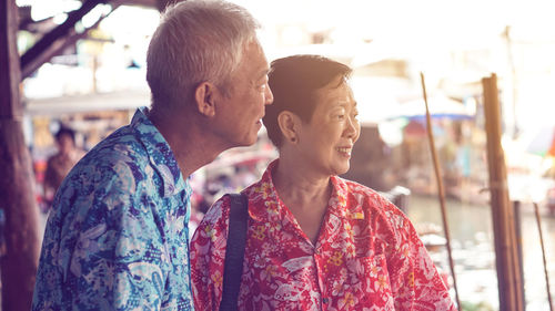 Asian senior couple trip to thailand floating market exotic southeast asia trip