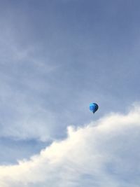 Low angle view of hot air balloon against blue sky