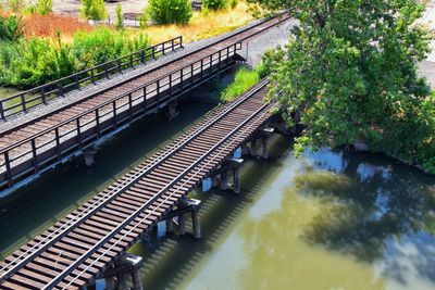 High angle view of train on bridge over canal