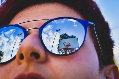 Close-up portrait of man wearing sunglasses