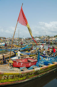 Boats moored in sea against sky